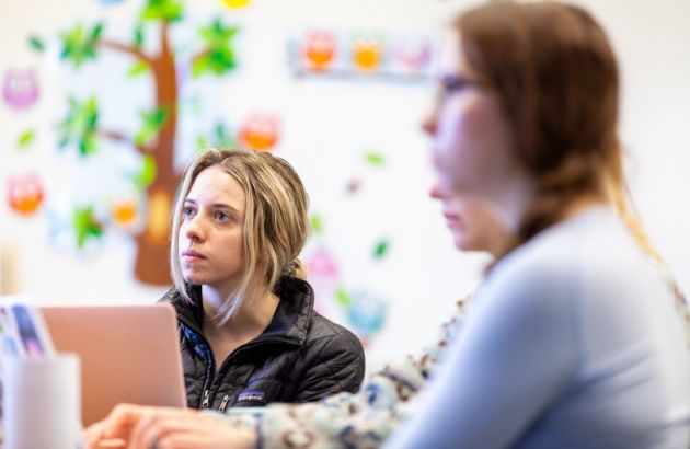 students listening in a classroom