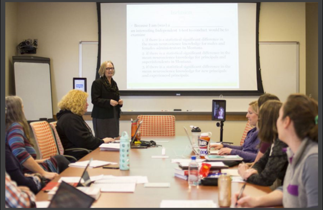 Faculty member teaching to students