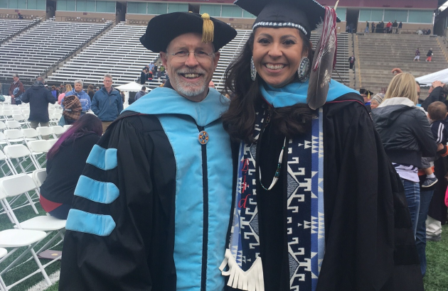 faculty with student on graduation