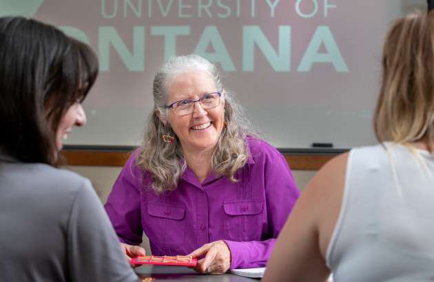 Faculty member smiling at students