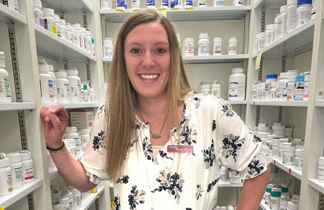 UM student Shelby Brooks poses for a photo in a pharmacy