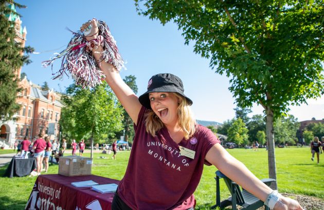 Student with pom-pom cheering