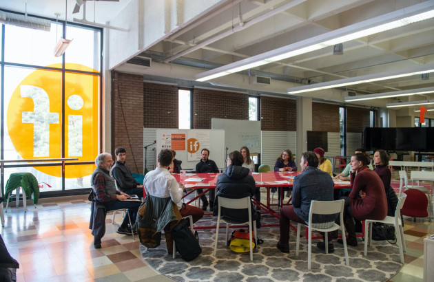 UM employees gather around a table for a professional development session