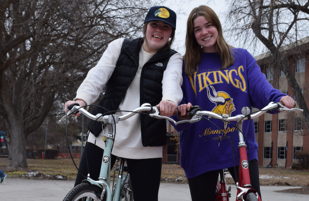 two girls posing with their new bike rentals