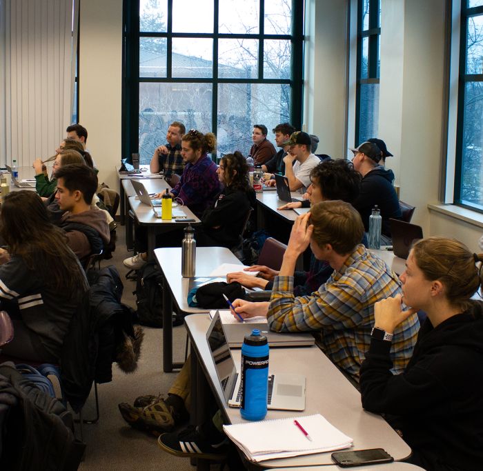 Students in a classroom listening to a lecture.