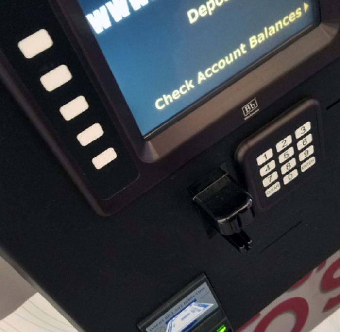 kiosk screen saying "deposit" or "check balance" options