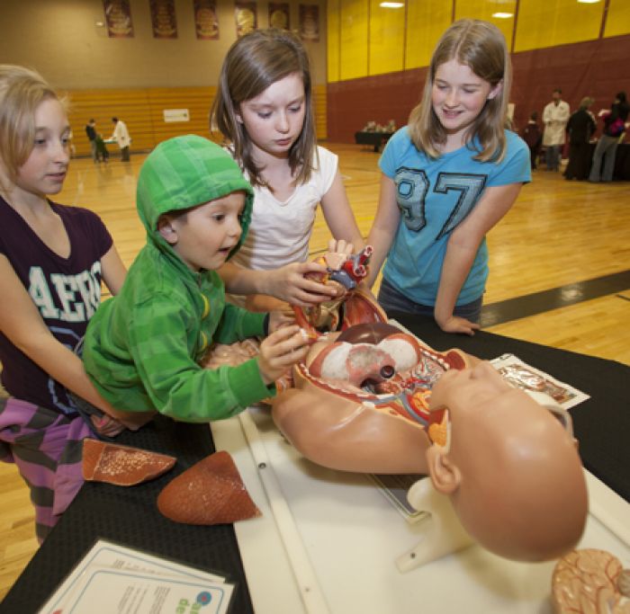 Children explore science exhibit during a Family Science Night in the Bitterroot Valley