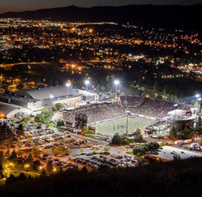 Looking down at Washington-Grizzly Stadium during a night football game.