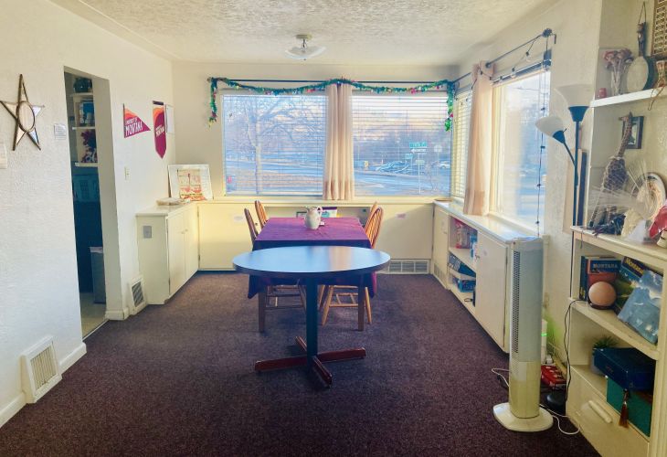 Dining space with two tables and four chairs