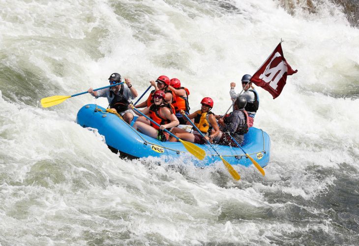 DHC students on a raft in rough water