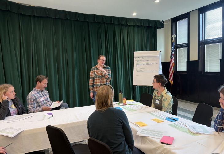 Shane Randle facilitates a conversation at a table with BWG members.