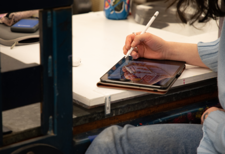 Student drawing on a iPad