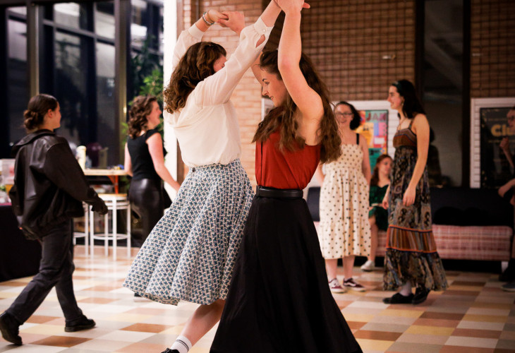 Two girls dancing in hoop skirts 