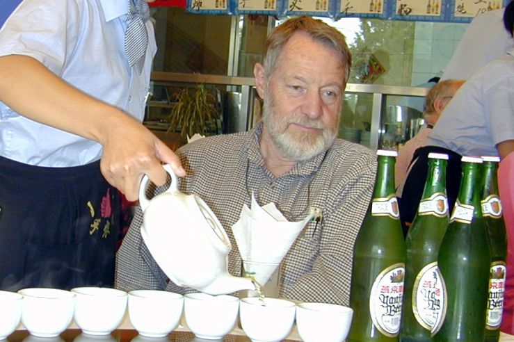 don served tea by a young chinese woman