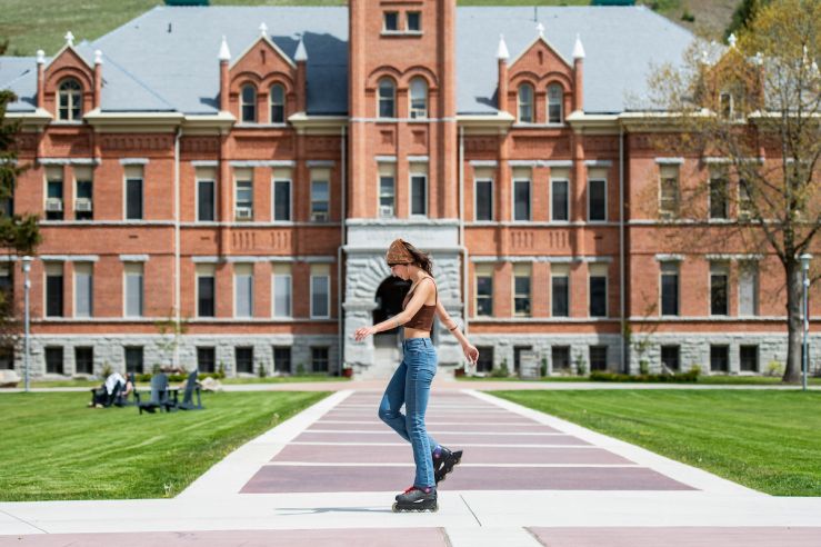 Girl roller skating on UM campus