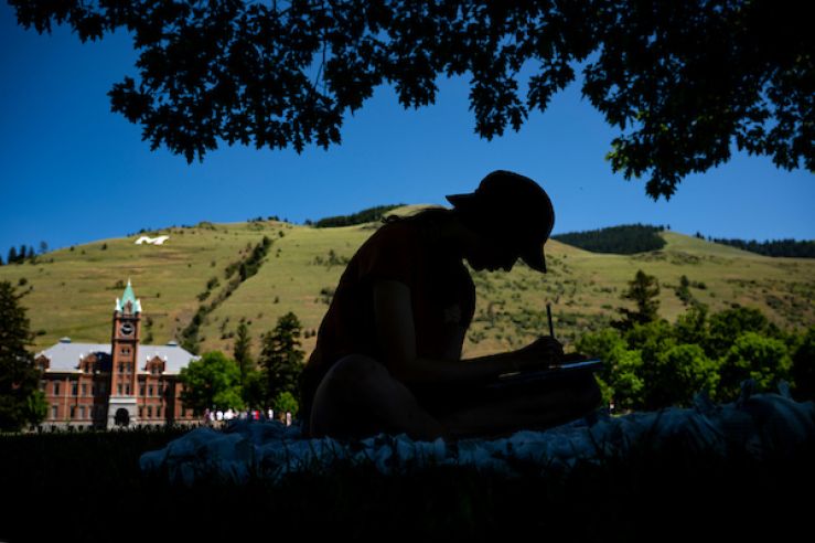 Student studying on UM campus