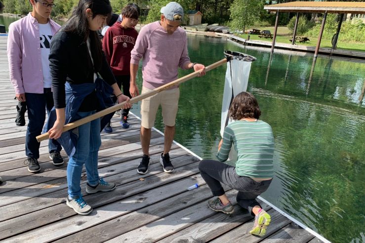 Students examine microorganisms at Flathead Lake.