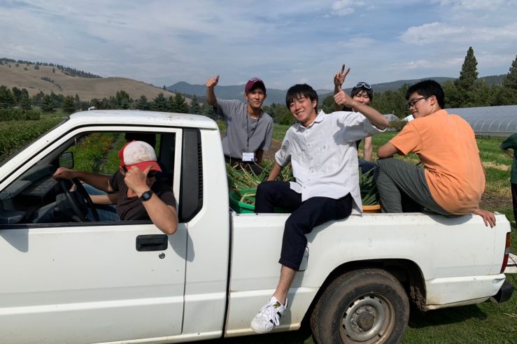 Students in a truck at the PEAS farm.