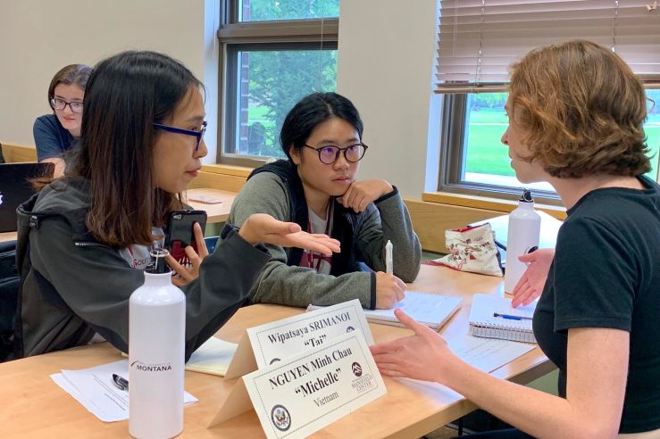 students at a discussion table