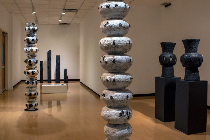 Large, floor-to-ceiling abstract sculptures in the UC Gallery