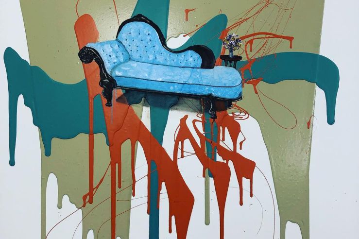 center is a blue vintage chaise lounge surrounded by large looping splotches of color in teal, red, olive green