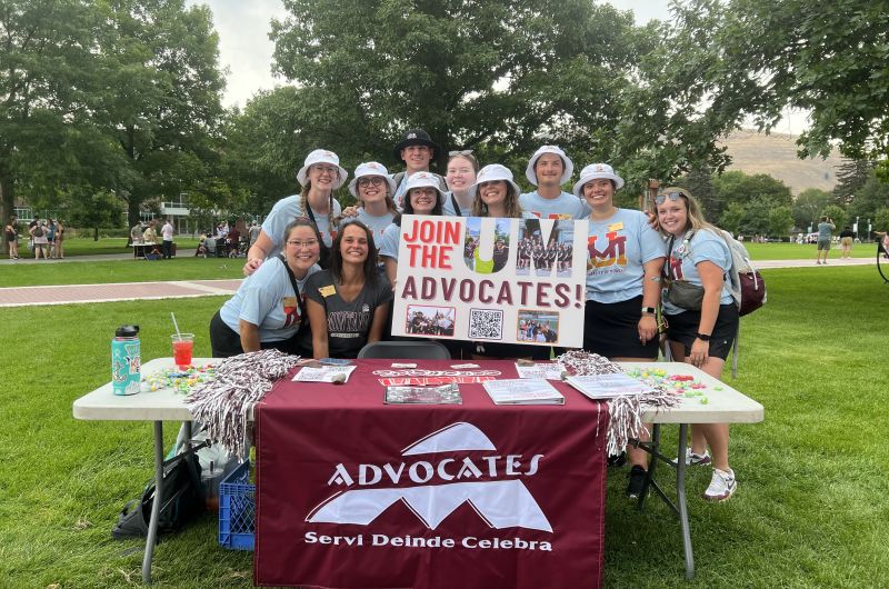 UM Advocates pose holding a "Join UM Advocates" sign 2023