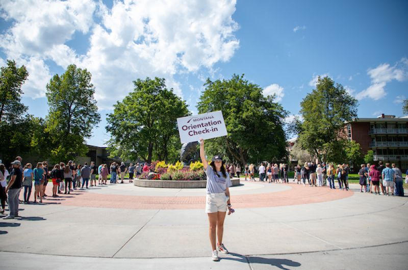 Jorgie poses with Orientation check in sign