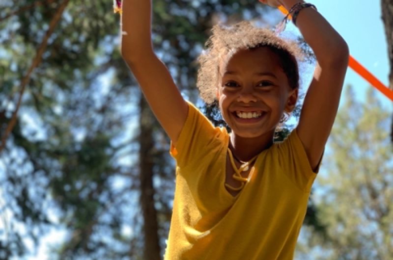 Child playing on a rope swing