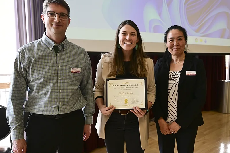 Beth Louden posing with two people