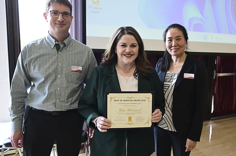 Chae Clearwood posing with two people