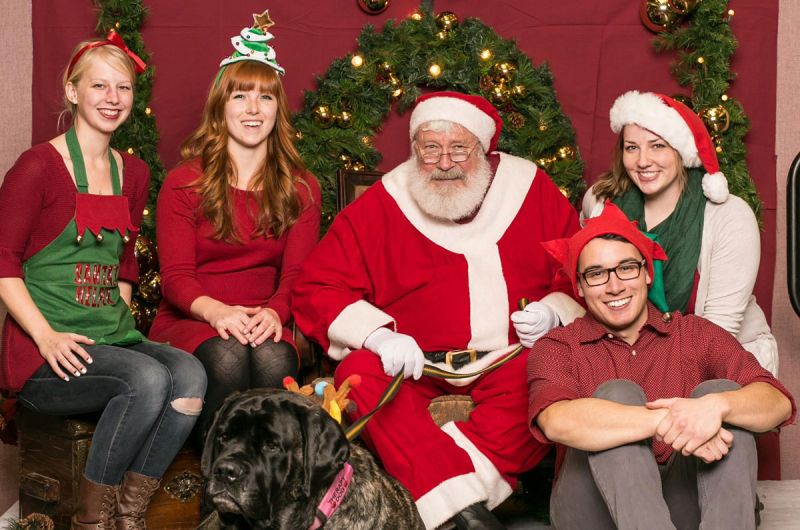 UM Gerontology Society Officers getting their photos taken with Santa at the Annual Photos with Santa Fundraiser