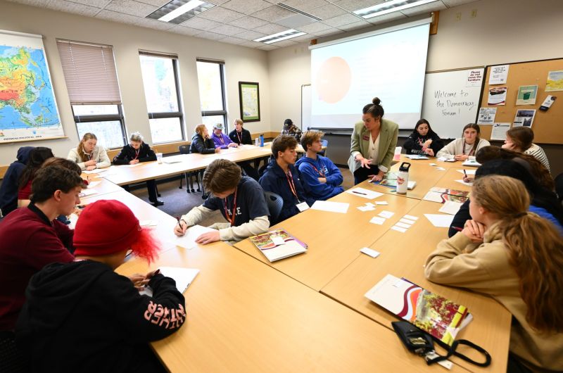 Students sitting in a group of tables