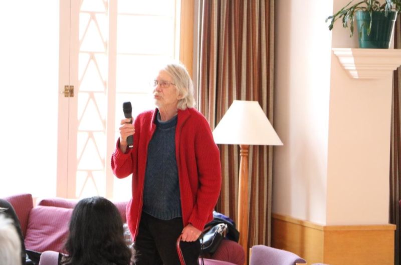 Dr. Keith Yale holds a microphone