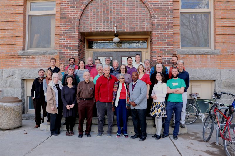 Faculty and Dr. Goins pictures on the steps of the math building