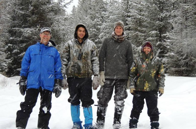 Mills lab members standing in the snow