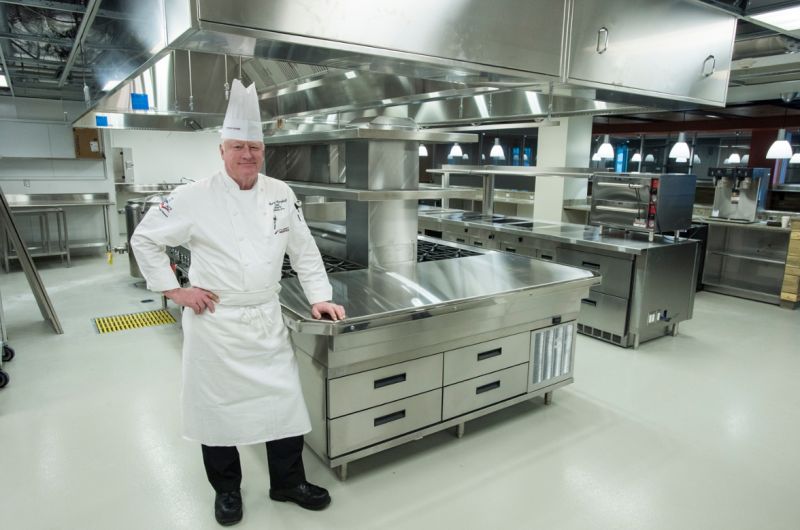 Culinary Arts Program Director Chef Thomas Campbell stands in one of three new kitchens.