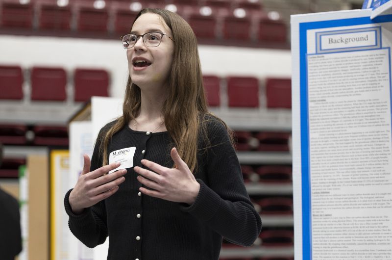 girl presenting at science fair