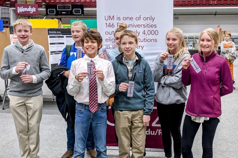 kids smiling with ribbons