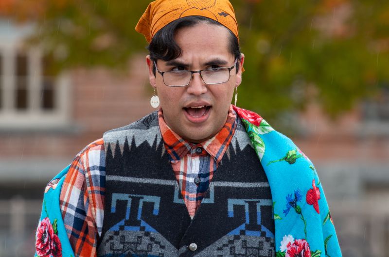 Former Kyiyo Exec and Student singing a round dance song on the oval.