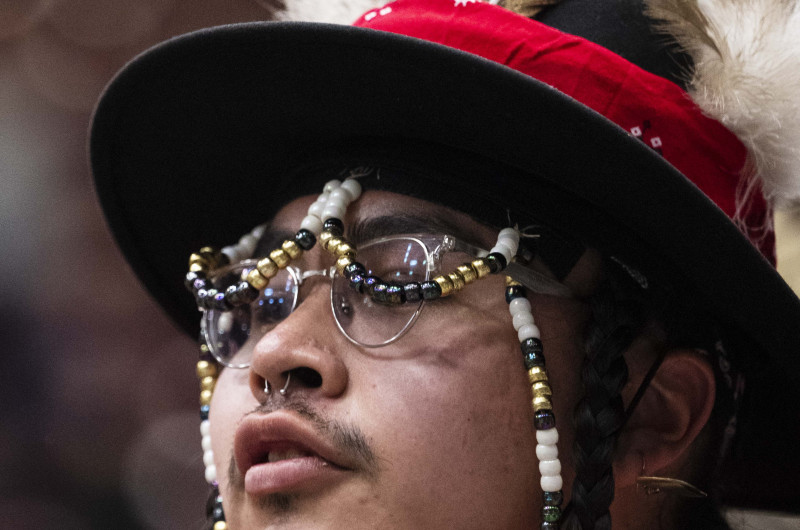 Former Student in regalia dancing