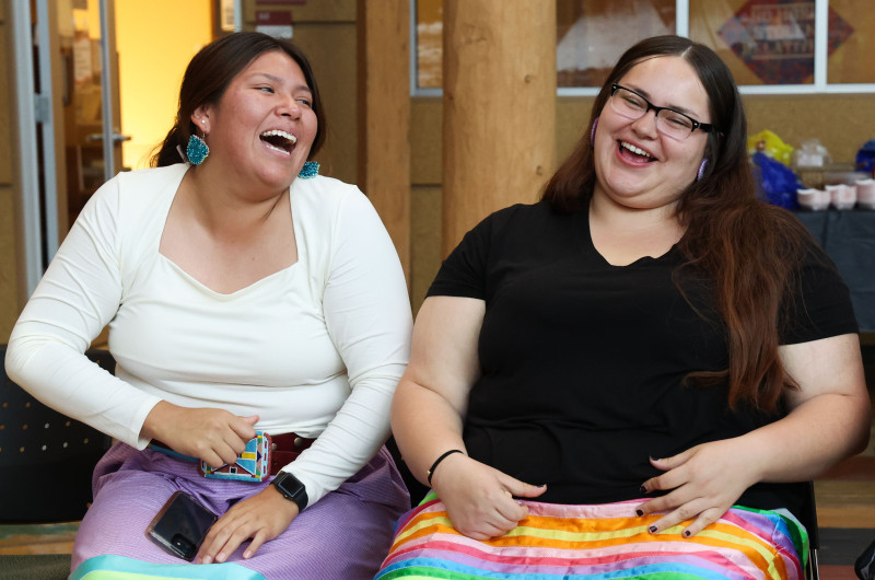 Students enjoying a game of stick game