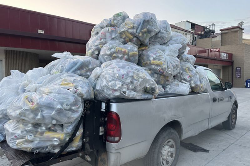 a truck overflowing with beer cans from the zero waste concert series