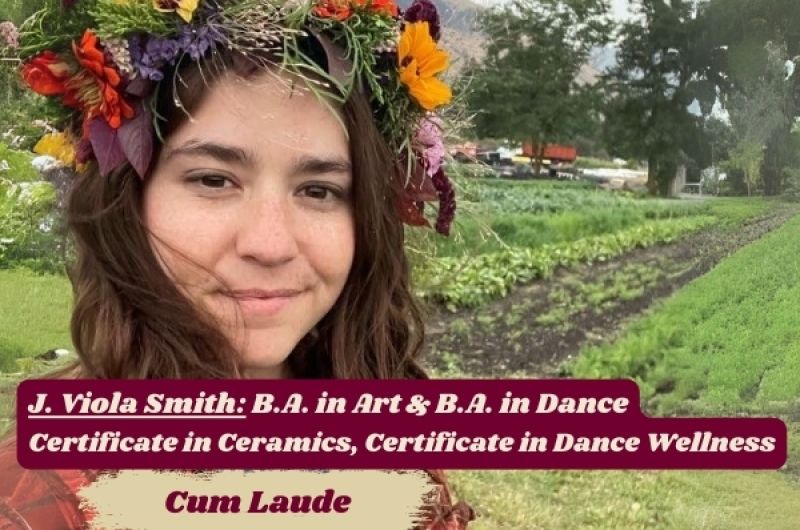 J. Viola Smith looks into camera, wearing flower crown