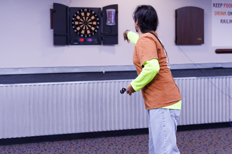 Man playing darts 