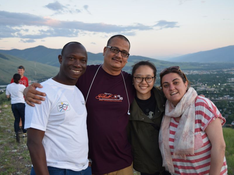 Four people at the top of hill