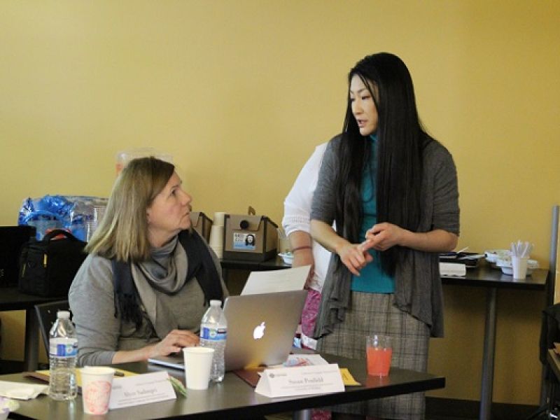 Two women talking to one another