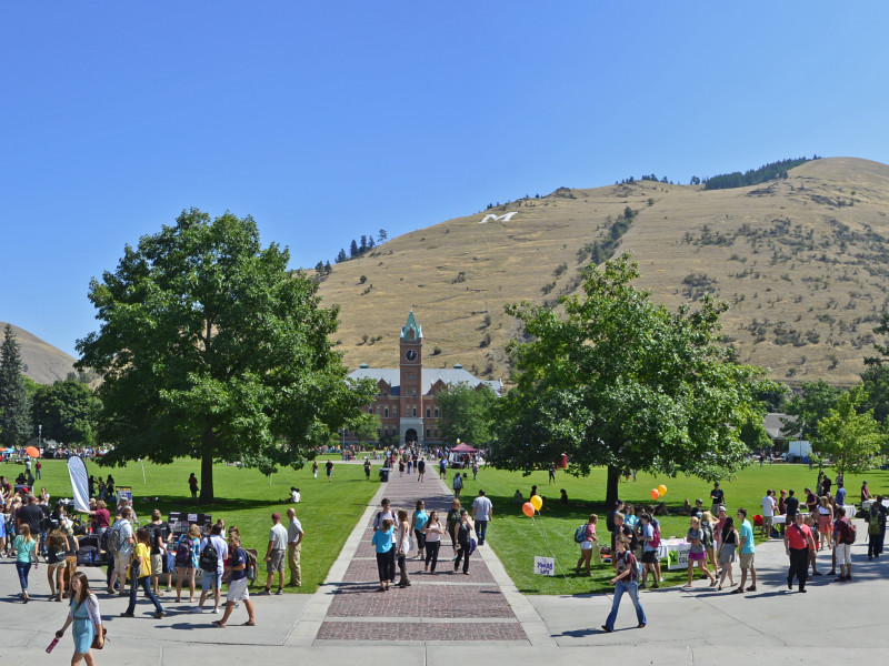 people cross the Oval at UM