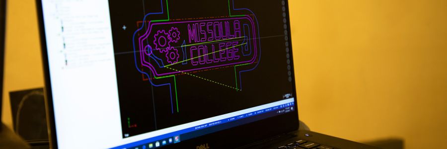 computer screen with missoula college and gears created in CAD