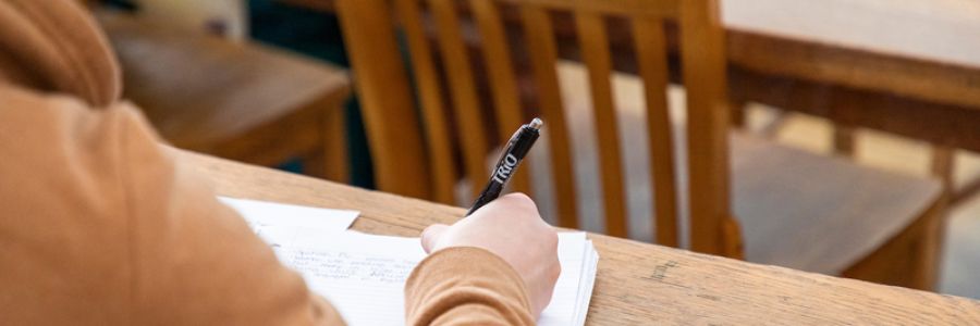 view of student taking notes from over their shoulder