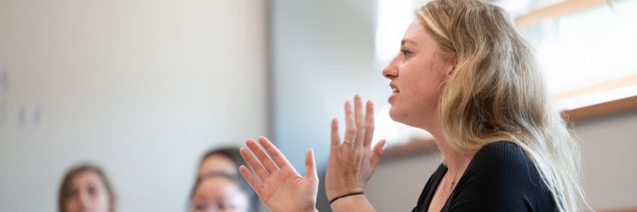 person talking and gesturing with their hands